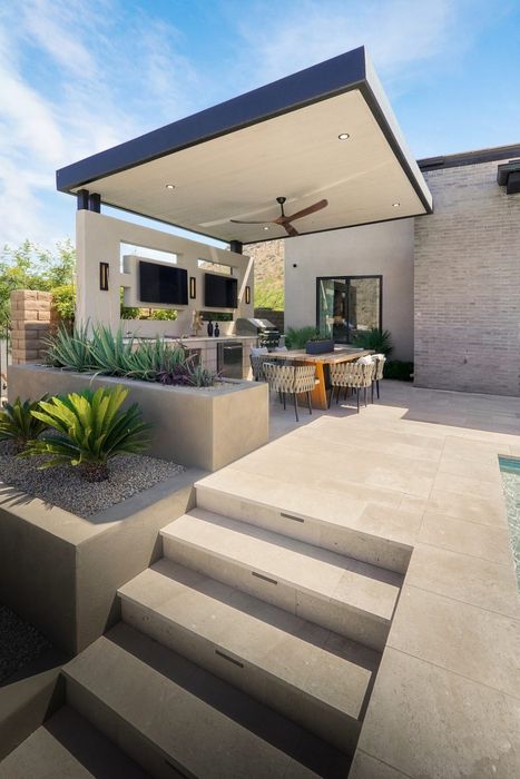 The covered outdoor kitchen and dining